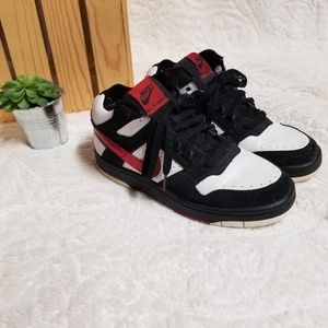 Red white and black nikes.